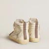 Slide-sneakers i nappa med glitterstjärna och detaljer i lackläder