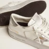 Stardan-sneakers med stjärna i silvermetalliskt läder och hälflik
