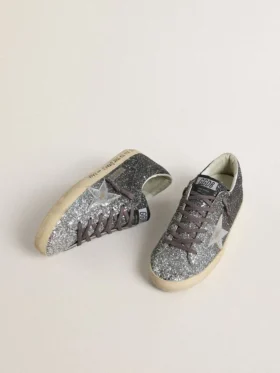 Super-Star för dam med glitteröverdel och silvermetallisk läderstjärna