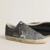 Super-Star för dam med glitteröverdel och silvermetallisk läderstjärna