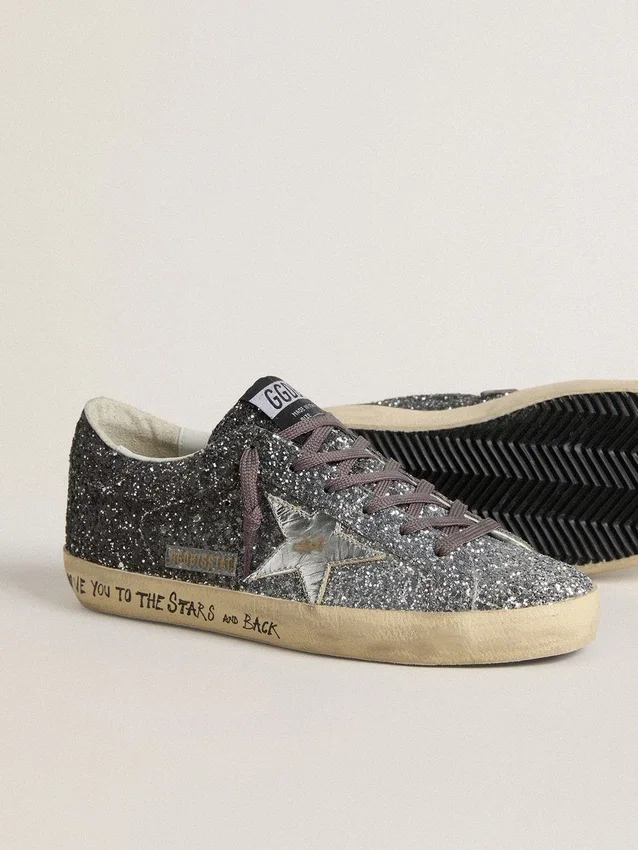 Super-Star för dam med glitteröverdel och silvermetallisk läderstjärna