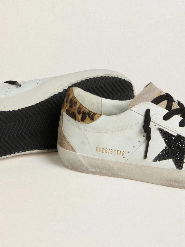 Super-Star för dam med svart glitterstjärna och hälflik i ponnyskinn med leopardmönster