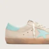 Super-Star för herr i beige mocka med aquagrön stjärna
