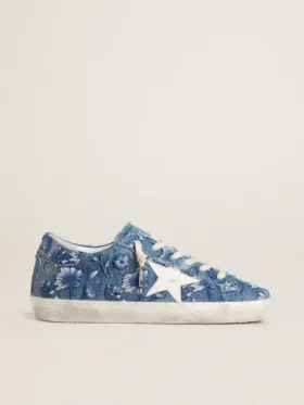 Super-Star LTD för damer i ljusblå denim med en vit läderstjärna och broderade blommor
