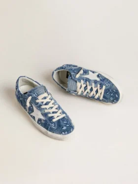 Super-Star LTD för damer i ljusblå denim med en vit läderstjärna och broderade blommor