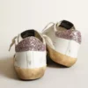 Super-Star med en beige stjärna och rosa glitter på hälfliken