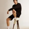 Svart sweatshirt från Archibald Star Collection med ton-i-ton-stjärna på framsidan