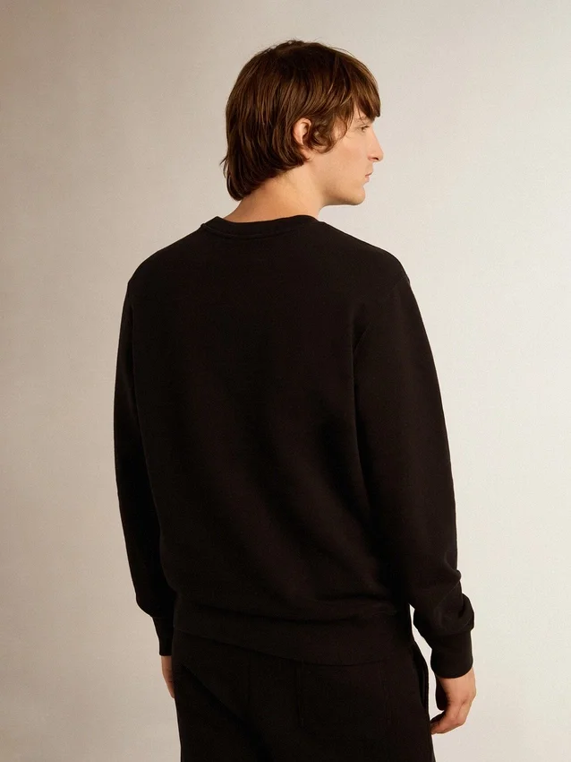 Svart sweatshirt från Archibald Star Collection med ton-i-ton-stjärna på framsidan
