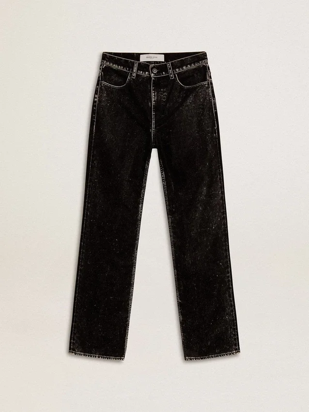 Svarta damjeans med en sammetliknande tvättad effekt