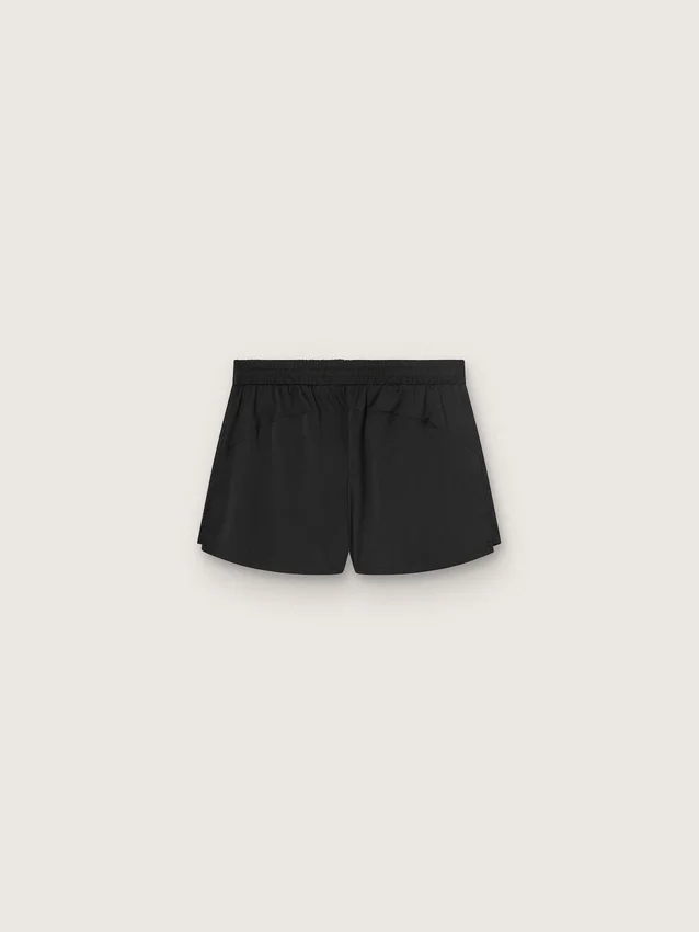 Svarta dubbla lager-sportshorts för damer