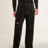 Svarta herrjeans med lös passform och kristaller med gradienteffekt över hela byxan