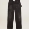 Svarta jeans i bomull med slitna detaljer och lappar framtill för dam