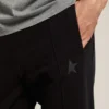Svarta joggingbyxor för herr med stjärna på framsidan