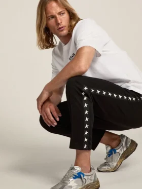Svarta joggingbyxor för herr med vita stjärnor på sidorna