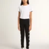 Svarta leggings för flickor med vita stjärnor på sidorna