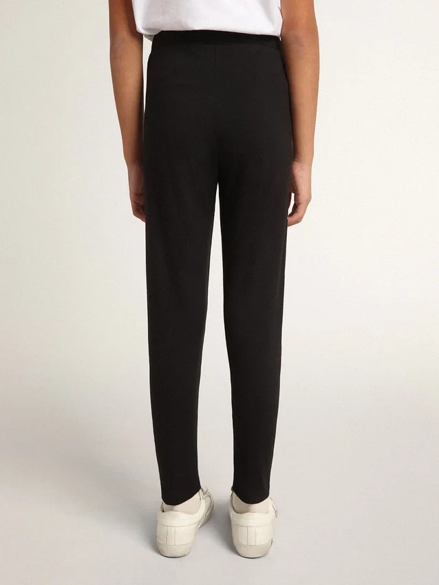 Svarta leggings för flickor med vita stjärnor på sidorna
