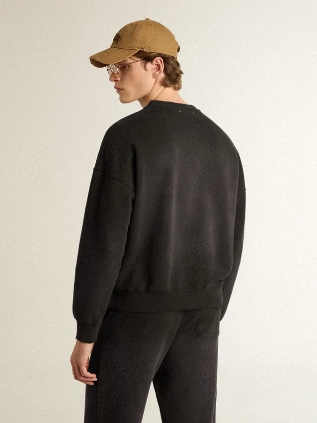 Unisex-sweatshirt i sliten svart bomull med broderad logotyp