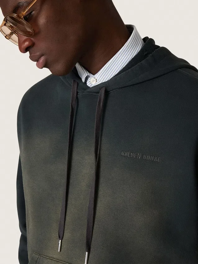 Unisex-sweatshirt med huva i svart bomull med blekt effekt