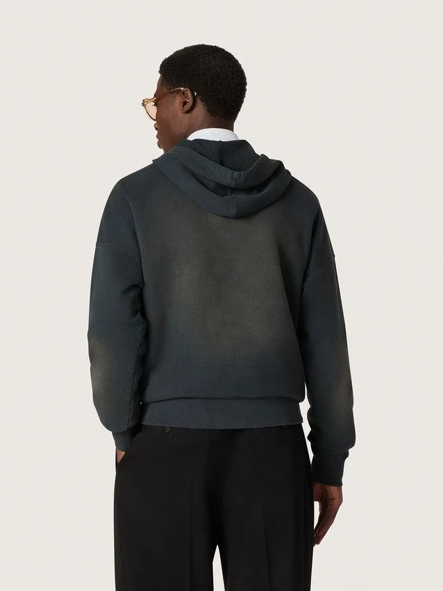 Unisex-sweatshirt med huva i svart bomull med blekt effekt