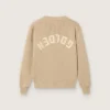 Unisex-tröja i guldbeige ribbat tyg för barn med logotyp på ryggen