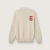 Unisex-tröja med rund hals i beige bomull med patch på framsidan och logotyp på baksidan
