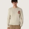 Unisex-tröja med rund hals i beige bomull med patch på framsidan och logotyp på baksidan