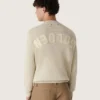 Unisex-tröja med rund hals i beige bomull med patch på framsidan och logotyp på baksidan