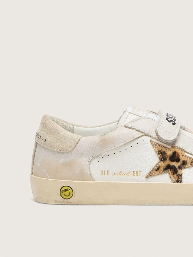 Young Old School i nappa med stjärna i ponnyskinn med leopardmönster och läderinsatser
